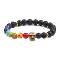 7-color beaded chakra bracelet with black lava rock and gold skull charm with red crystal eyes - Skull Lava Stone
