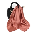 Detail of dusty rose satin scarf with elegant drape tied on a black leather handbag - One Size / Faux Silk Satin / Dark Pink