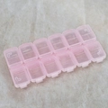 Scatola organizer rosa e trasparente a 12 scomparti per nail art e piccoli gioielli - Rosa trasparente