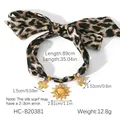 Collana a nastro leopardato con ciondoli a sole e croce con dimensioni e peso - Bracciale in Nastro di Seta con Stampa Leopardata (HC-B20381)
