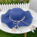 Close-up of deep blue straw sun hat with wavy brim and bohemian bead leaf pendants - M (56-58cm) with Windproof Rope / Navy Blue