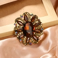 Vintage floral brooch with amber gemstones and iridescent crystals on a gold base - Brown