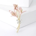 Elegant floral brooch with pink calla lilies and butterfly crystals on gold-tone stem - Pink
