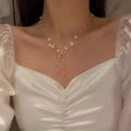 Close-up of pearl bowknot tassel necklace on collarbone with sparkling rhinestones - 3# Gold Pearl Bow Tassel Style