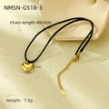 Macro shot of 18K gold heart pendant with black cord on geometric stone display - Black Rope Gold Heart Small Pendant (NMSN-G518-3)