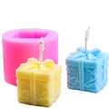 Pink silicone gift box candle mold with textured blue and yellow wax samples - Gift Box B Pink 90g