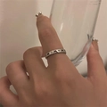 Detail showing 925 silver ring with engraved cross pattern and small stones worn on finger - Cross Inlaid Silver Style(JZ0625)