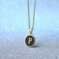 Golden round pendant necklace with black enamel disc and letter P initial charm - Letter P