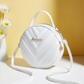 White circular crossbody bag with V-quilt stitching and golden hardware details - White