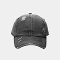 Close-up of distressed dark gray baseball cap with white contrast stitching and torn detail - Adjustable / Black