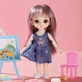 Movable doll with long pink hair wearing a blue denim dress with a cute puppy pattern - Denim Dress Girl