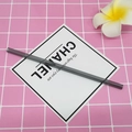 Minimalist translucent smoke grey borosilicate glass straw shown on a pink patterned background - 8*200mm / Starry Grey Straight