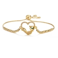 Detail of 18K gold heart bracelet featuring a cat silhouette with green gem eyes - Heart Cat-Box Chain