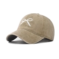 Detailed embroidery of a white bow on a washed khaki cotton baseball cap with textured finish - Khaki Bow
