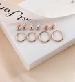 10-piece rose gold earring set with studs and hoops on a white display stand - Rose Gold