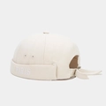 Close-up of PARIS embroidery and adjustable drawstring on beige canvas brimless cap - Beige