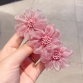 Pink camellia flower hair clip with soft fabric petals and three blossoms on a spring barrette - Spring Clips / Dusty Rose Mesh Stamen Style