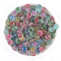 Transparent acrylic letter beads with colorful sequins in a white ceramic bowl - Glitter + Colorful Text