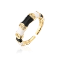 Detailed view of bamboo-style gold ring with black and white enamel and zircon stones - Adjustable Open / Black and White (12699)