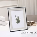 Detail of black picture frame with white wood grain inner border and botanical art print - 5 inch (9*13cm) Tabletop / Cyan Wood