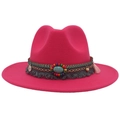 Detail view of rose red felt western hat with turquoise beads and ethnic tassel band - Rose Red