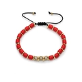 Red beaded bracelet with gold accents and micro-paved crystal cylinders on white background - 389 Red