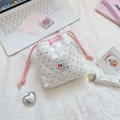 Detail of star pattern drawstring pouch with lace edge and pink cotton cord on desk - Wrinkled Cloth Blue Star
