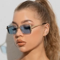 Vintage gold rectangle metal sunglasses with light blue lenses worn by female model - Gold Frame Blue Lens