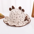 Dettaglio cappello da pescatore neonata con stampa a fiocchi e bordo con volant fini - 48-50cm(6 Mesi-2 Anni) / Bianco Sporco