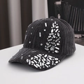 Detailed close-up of velvet texture and sparkling rhinestones on this luxury black baseball cap - Adult / Black