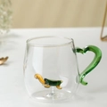 Creative glass mug with green handle and cute miniature glass turtle inside - Turtle