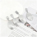 Silver oval lava heart earrings with geometric ripple texture on a minimalist display - Silver EH009-1 (Spiral Oval)