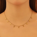 Detail of gold-tone necklace featuring multiple infinity pendants on a model's neck - Gold Infinity