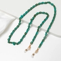 Close-up of turquoise acrylic link chain with gold lobster clasps for glasses - Turquoise