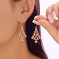 Golden Christmas tree stud earrings with white pearls shown on a female model - Gold Hollow Pearl Christmas Tree (ER25Y0271-4)