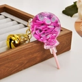 Lollipop shaped keychain with pink dragon fruit slices and golden bell accessory - Fruit Lollipop [Purple Dragon Fruit]
