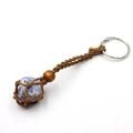 Handmade bohemian keychain with blue natural stone wrapped in brown woven mesh - Blue Spot Stone + Brown Mesh Keychain