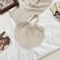 Detail of cream woven cotton mesh bag showing intricate diamond hollow pattern and texture - Small