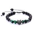 Detailed macro view of wolf head charm on adjustable lava stone and cat eye beaded bracelet - Type B Lava Stone + Green Tiger Eye
