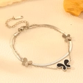 Close-up of double-layer stainless steel bracelet featuring butterfly charms and S.STEEL tag - Steel Color Black Shell Butterfly Bracelet (O502)