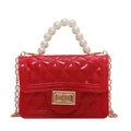 Red silicone jelly bag for girls featuring diamond quilt pattern and pearl handle - Red