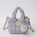 Grey quilted cloud bag with gold bow detail and fluffy pompom charm accessory - Gray
