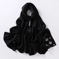 Detailed view of black bubble chiffon hijab with exquisite handcrafted rhinestone flowers - Black