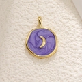 Detailed close-up of a gold celestial moon pendant with purple oil drip texture - Moon