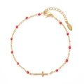 Detail of golden stainless steel bracelet with red beads and a cross pendant charm - Gold Red Beads