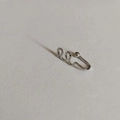 U-shaped silver non-pierced nose clip with textured wavy design and bead ends - White K Wave Style (G-579)