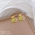Macro shot of gold lemon earrings with green enamel and white pearls on silk - Silver Earring Post Copper Gold Plated / Lemon Stud Earrings (C252)