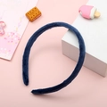 Blue plush fabric headband accessory for women on a soft pink decorative background - Sapphire Blue