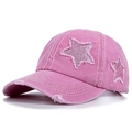 Detailed close-up of pink washed cotton baseball cap with sequin star and distressed holes - Pink