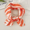 Elegant cotton linen scarf with orange leaf prints tied in a bow on a French background - Leaf Vein Red